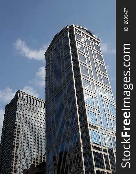 Modern skyscrapers against a bright blue sky