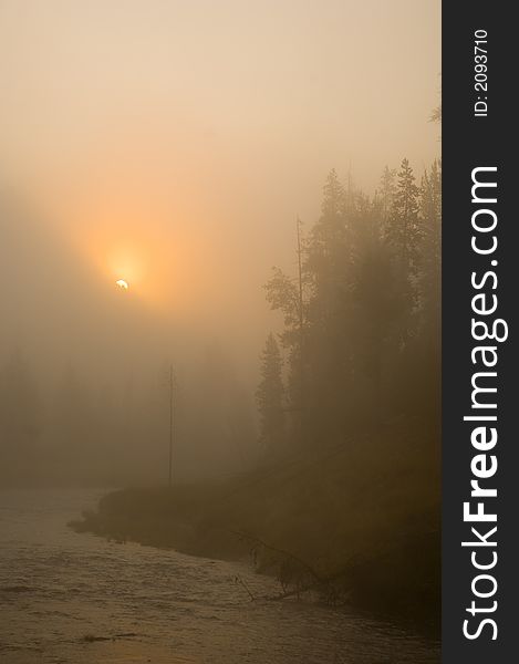 The sun rises over the mountains in Yellowstone National Park. The sun rises over the mountains in Yellowstone National Park