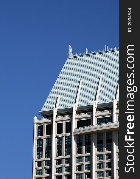 Modern skyscrapers against a bright blue sky