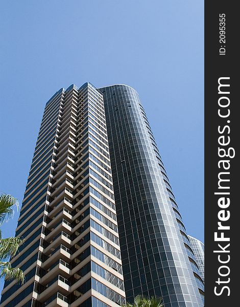 Modern skyscrapers against a bright blue sky