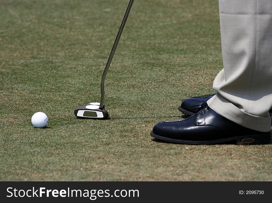 A golfer playing golf in the field.