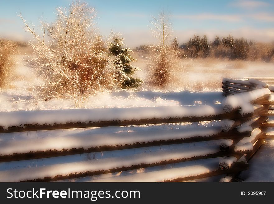 A snow covered fence adds visual motion to a quiet winter scene. This version has been enhanced with a satiny appearance. A snow covered fence adds visual motion to a quiet winter scene. This version has been enhanced with a satiny appearance.