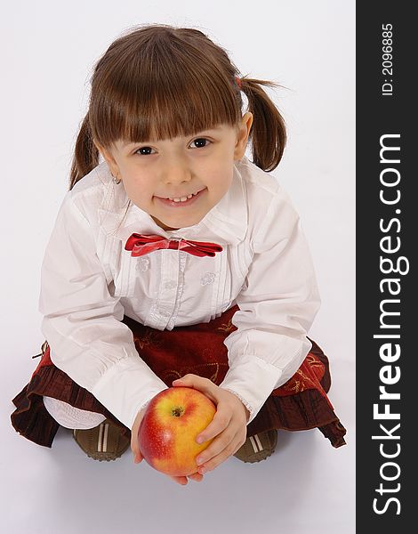 Picture of little smiling girl with big apple. Picture of little smiling girl with big apple