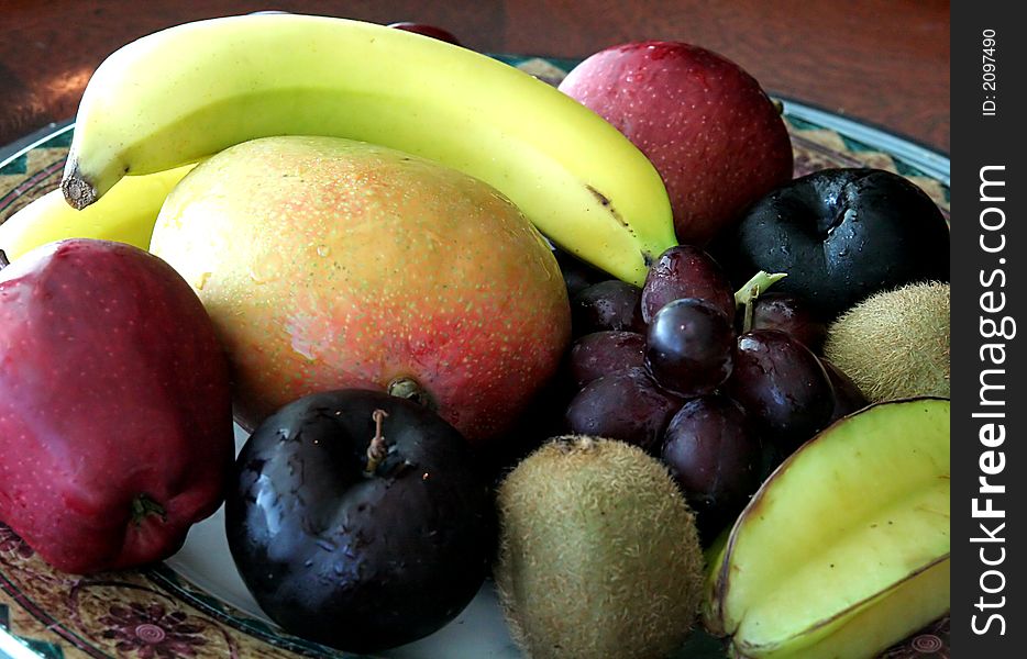 A nice arrangement of fresh fruit in a bowl. A nice arrangement of fresh fruit in a bowl