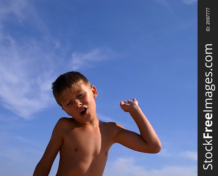 Young boy with a sky background