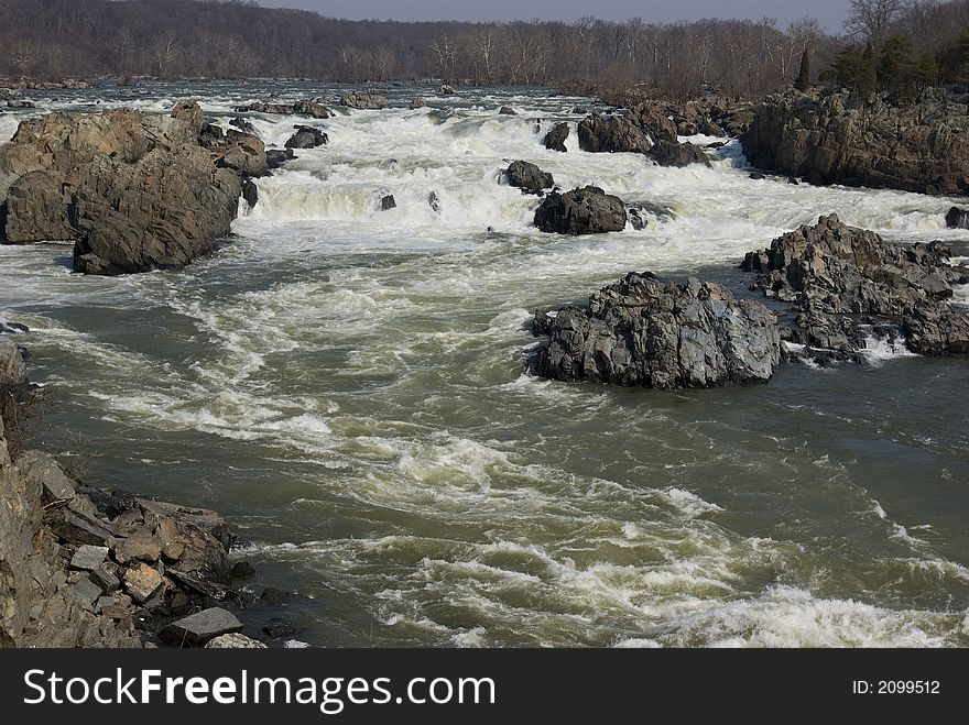 The Potomac river plunges over the rocks at Great Falls Virginia. The Potomac river plunges over the rocks at Great Falls Virginia
