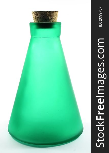 Isolated green bottle made of frosted glass. Backlight with white background