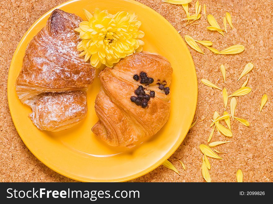 Picture of a Two croissaints on yellow plate