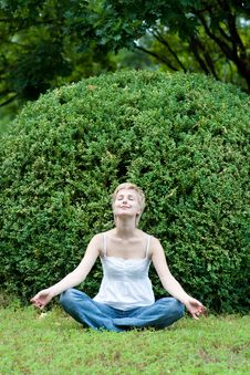 Yoga Woman On Green Grass Royalty Free Stock Photography