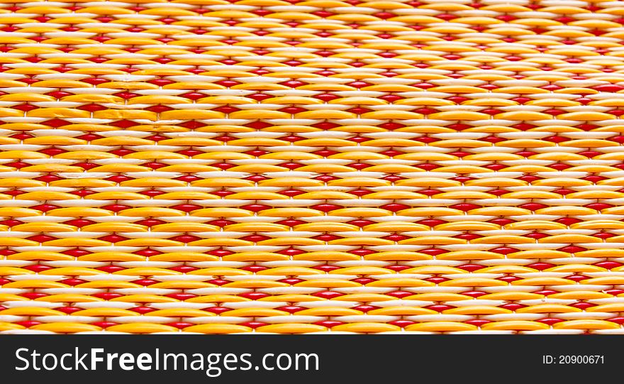 Thai woven mats yellow and red alternating back and forth