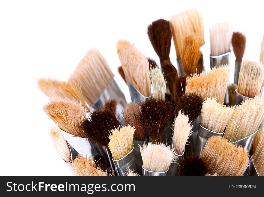 Closeup of artist paintbrushes on white background