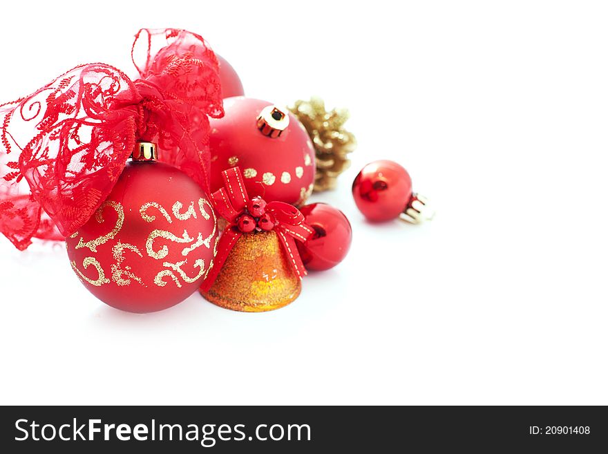 Red christmas decorations over white