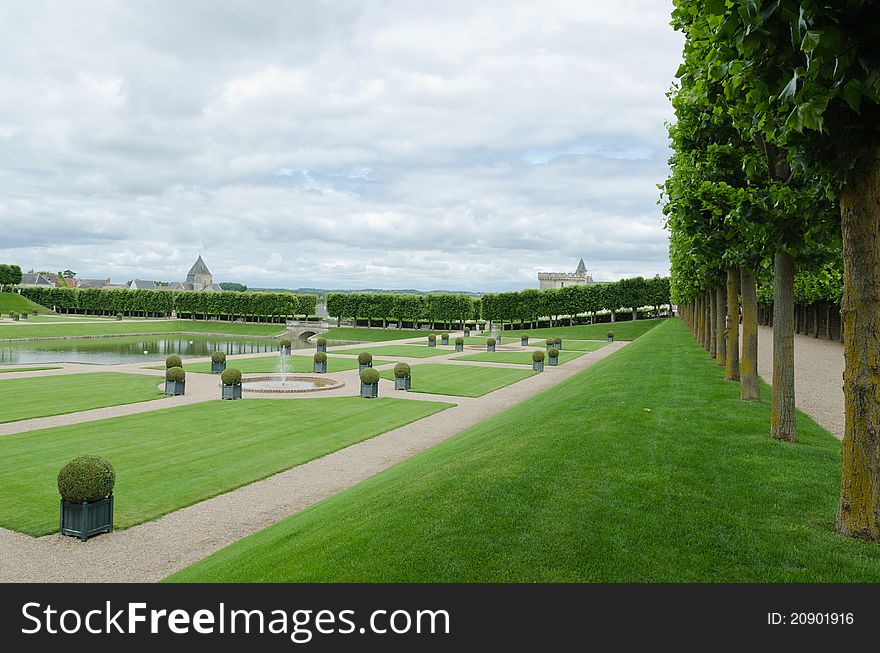 The garden of the Villandry castle, with the tower of the castle in the background. The garden of the Villandry castle, with the tower of the castle in the background