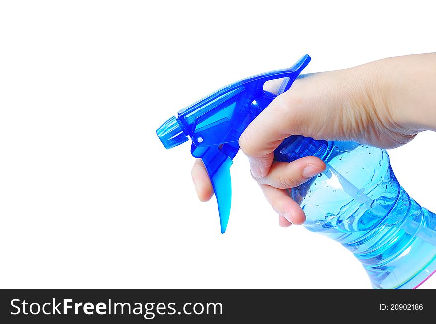 Hand holding blue spray bottle, filled with water. Hand holding blue spray bottle, filled with water