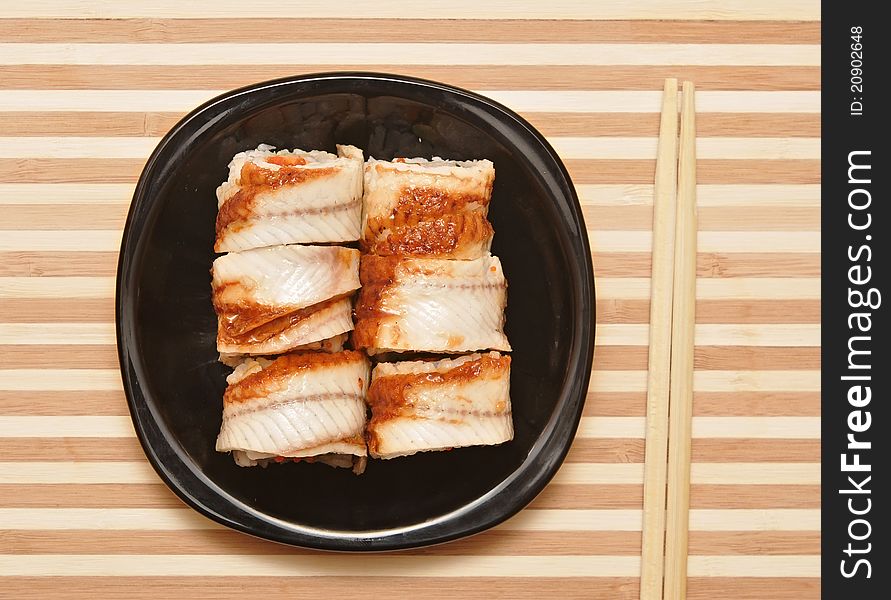 Sushi with chopsticks