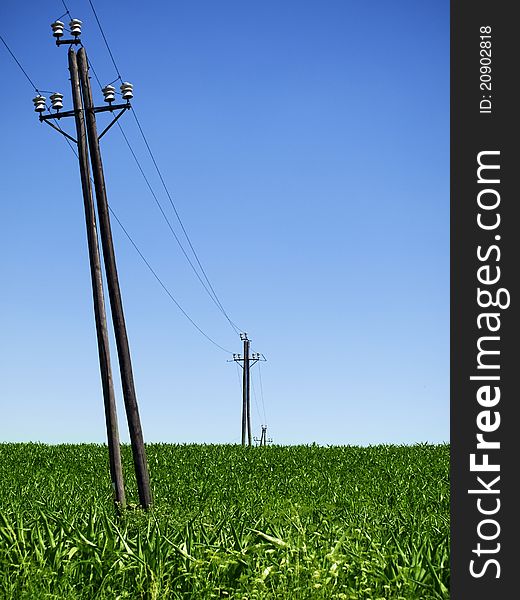 Old power lines and clear blue sky