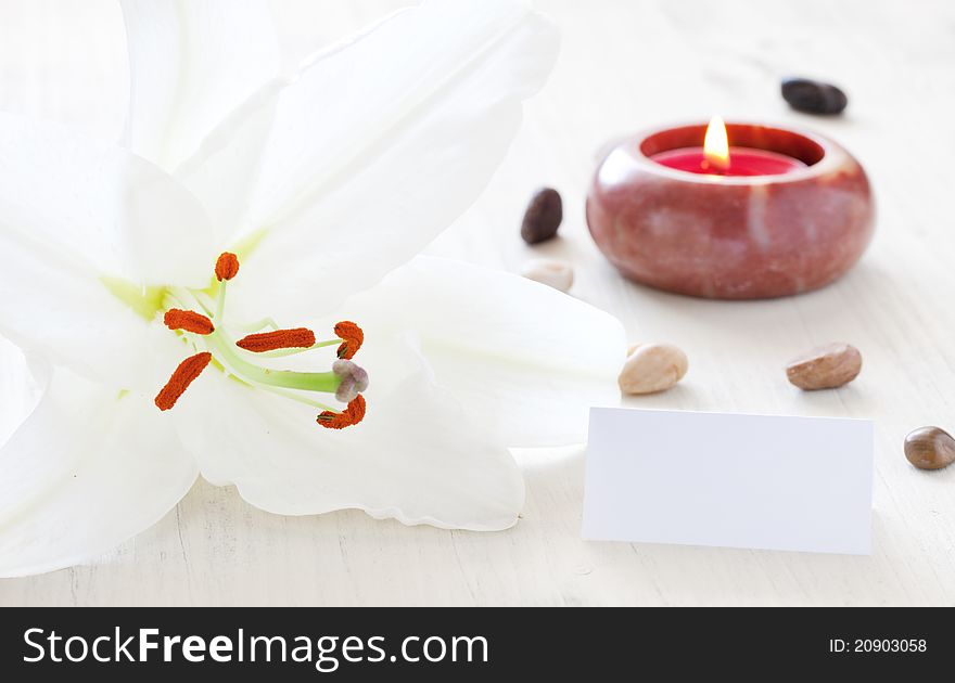 Wellness concept with candle and lily. Wellness concept with candle and lily