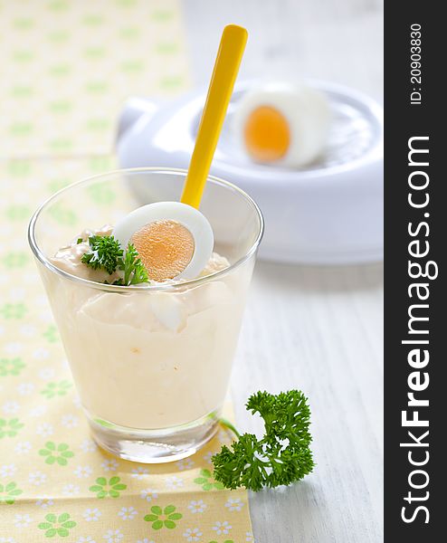 Fresh egg salad in a glass with parsley