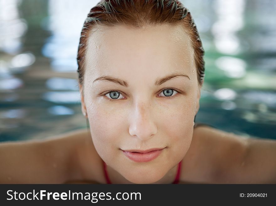 Close up portrait of a beautiful woman in swimming pool. Close up portrait of a beautiful woman in swimming pool