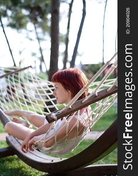 Young woman portrait relaxing on hammock. Young woman portrait relaxing on hammock