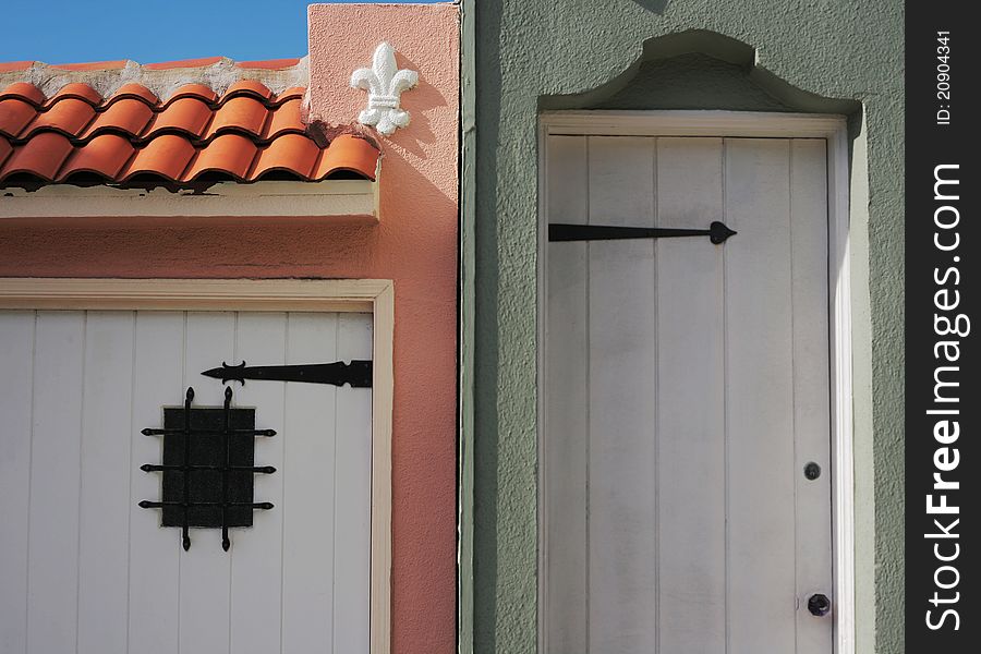 Door part of tile roof and window of garage. Door part of tile roof and window of garage