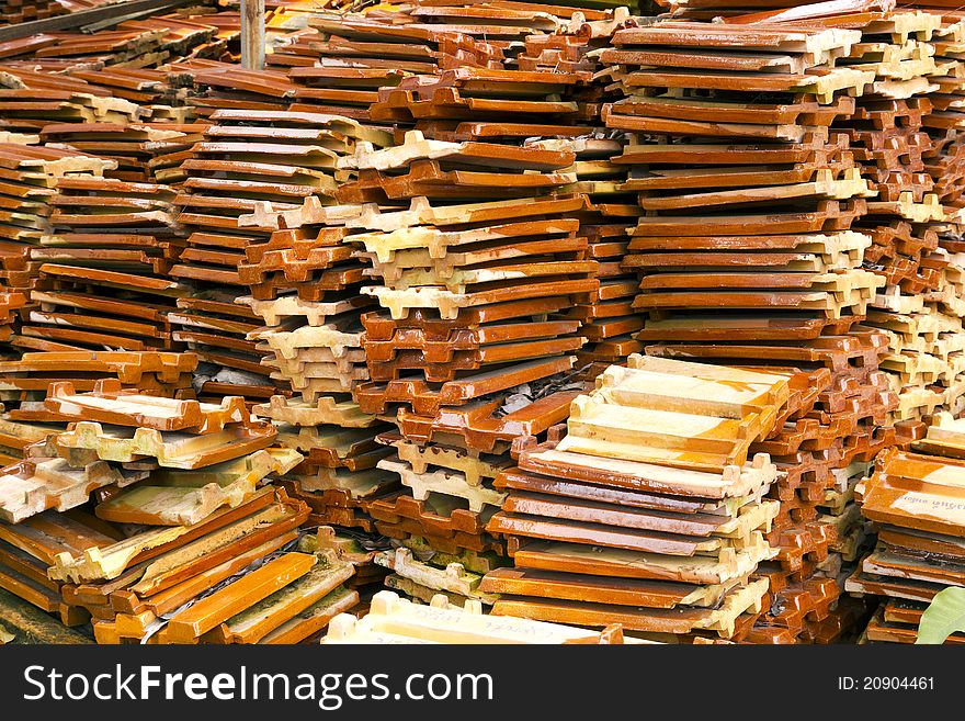 Close up of a stack of ceramic roof tiles. Close up of a stack of ceramic roof tiles.