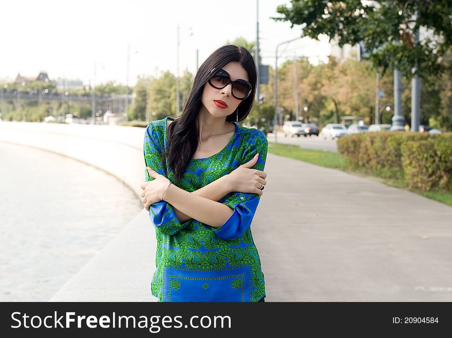 City girl walking outdoor on embankment