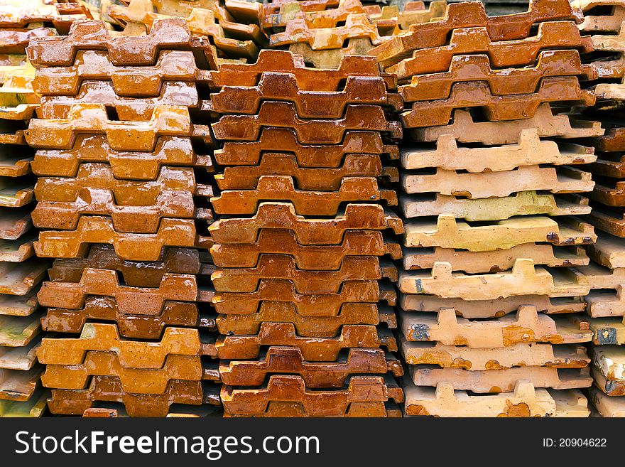 Close up of a stack of ceramic roof tiles. Close up of a stack of ceramic roof tiles.