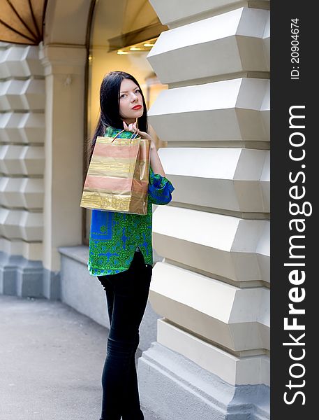 Shopping girl walking outdoor in city