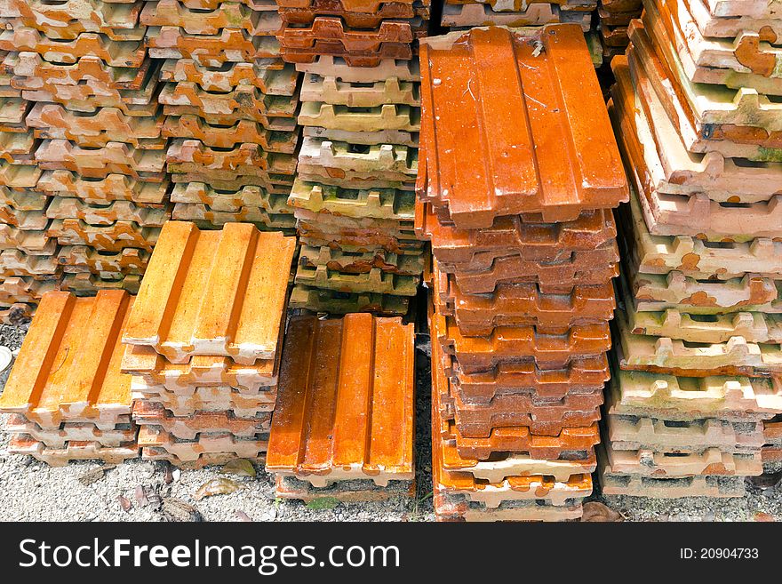 Close up of a stack of ceramic roof tiles. Close up of a stack of ceramic roof tiles.