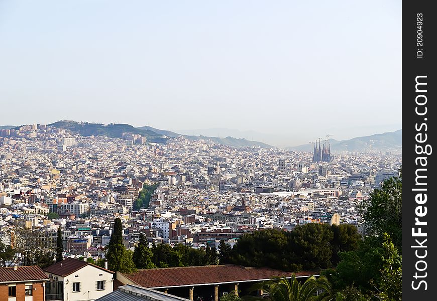 View of the City of Barcelona , Spain from a nearby hill. You can view the Sagrada Familia church at right.