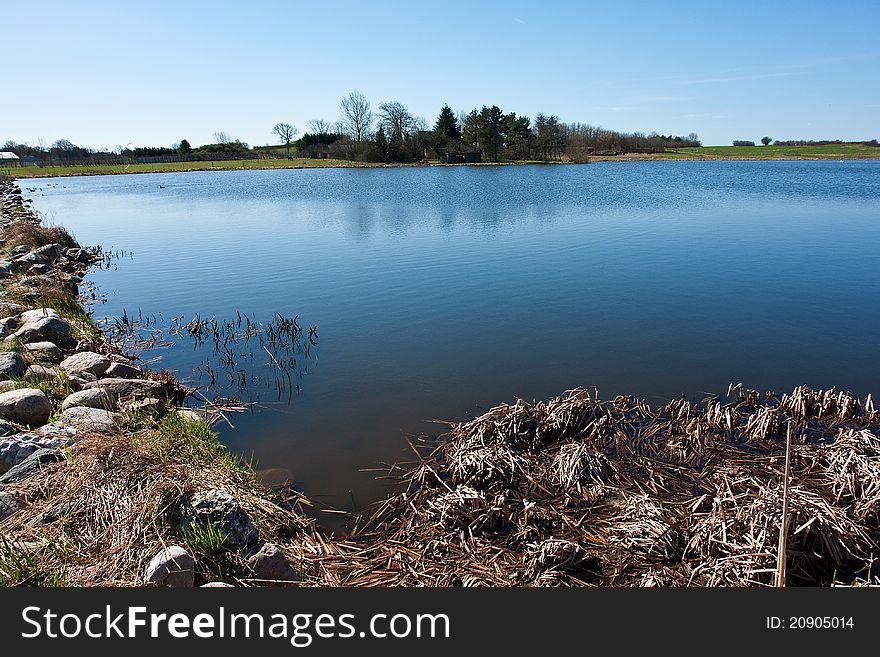 Beautiful blue water lake landscape in the summer. Beautiful blue water lake landscape in the summer