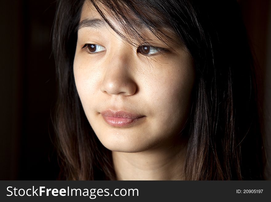 A close up of a young Asian woman.