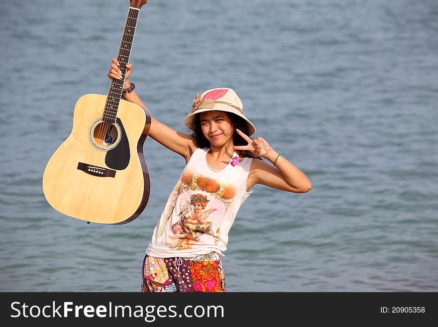 Pretty Young Woman With Guitar