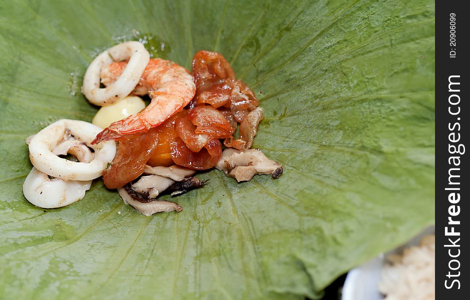 Thai fried rice (sea food) in lotus leaf package. Thai fried rice (sea food) in lotus leaf package.