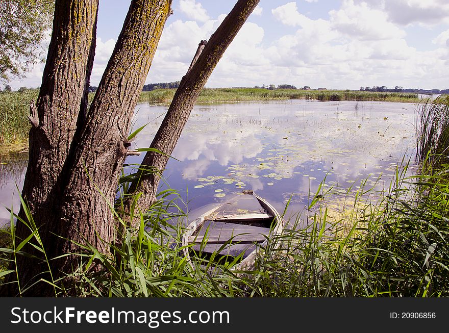 Lake Landscape With Old Boat