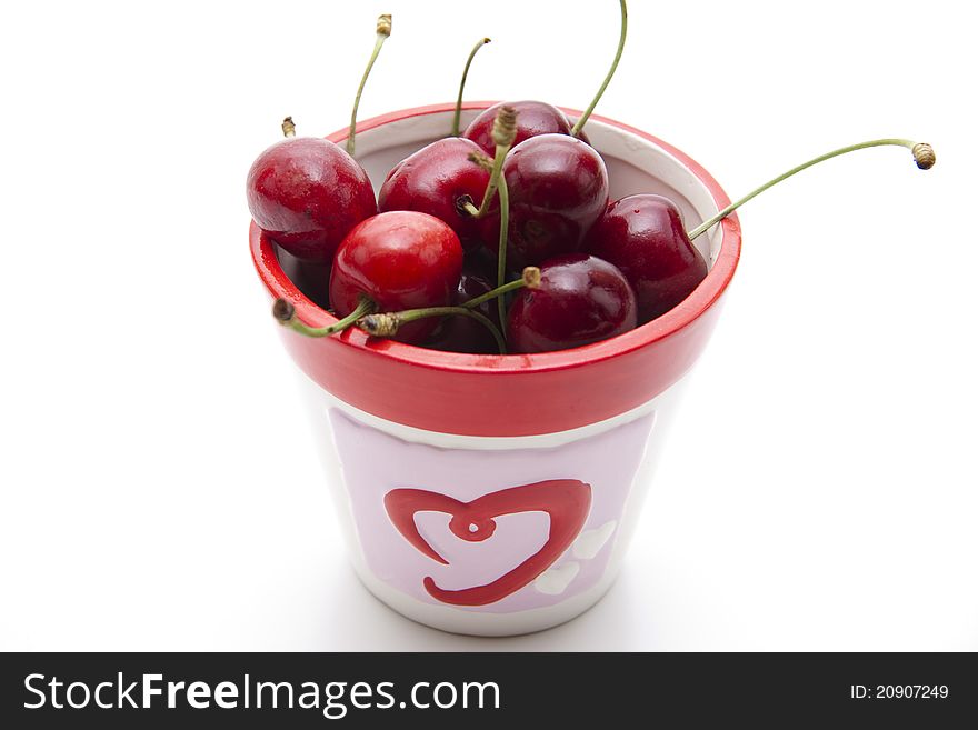 Red cherries with stem in the cup. Red cherries with stem in the cup