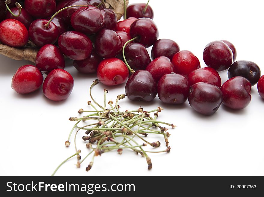 Red cherries with stem onto white background