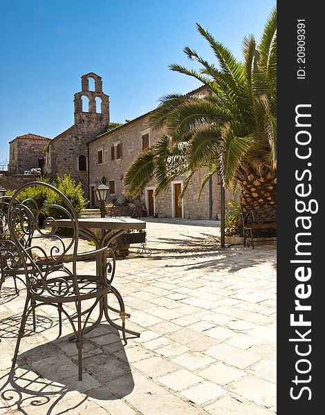 View on old table and alley in Budva, Monatenegro. View on old table and alley in Budva, Monatenegro.