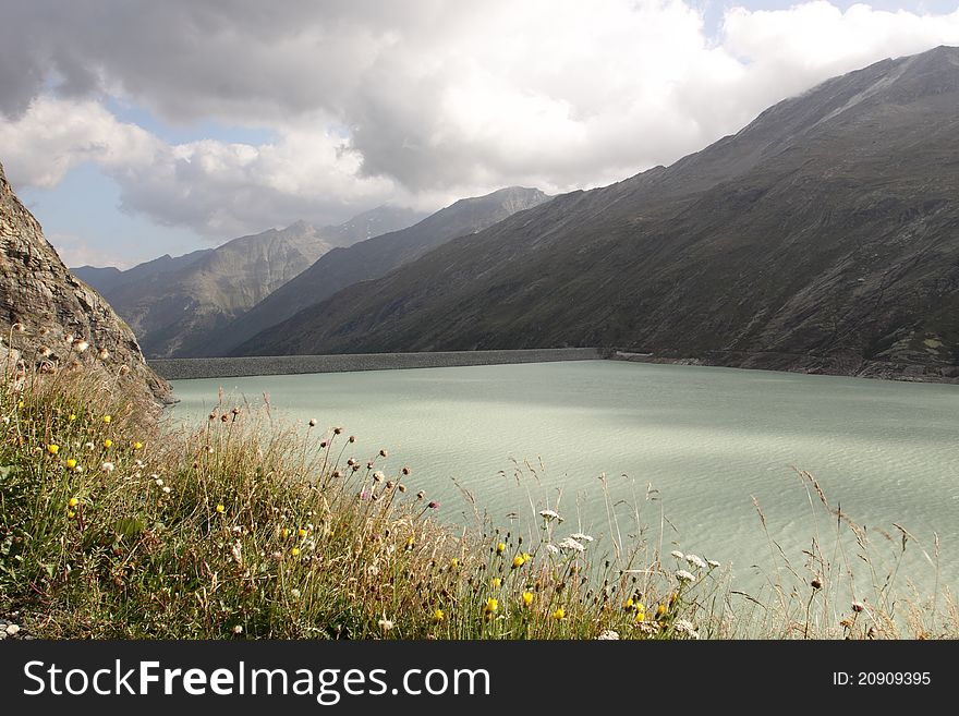 The water reservoir Mattmark dam in the Saas Valley, Switzerland.