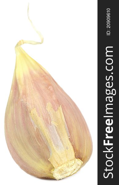 A clove of garlic on a white background