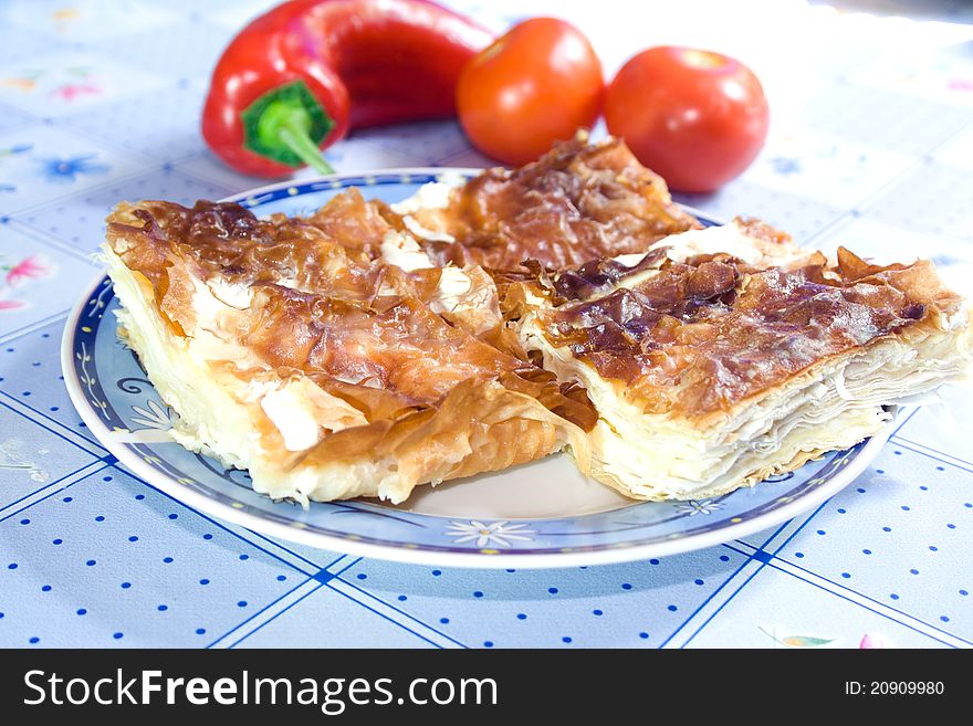 Domestic pie with cheese on plate