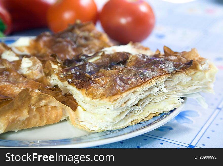 Domestic pie with cheese on plate