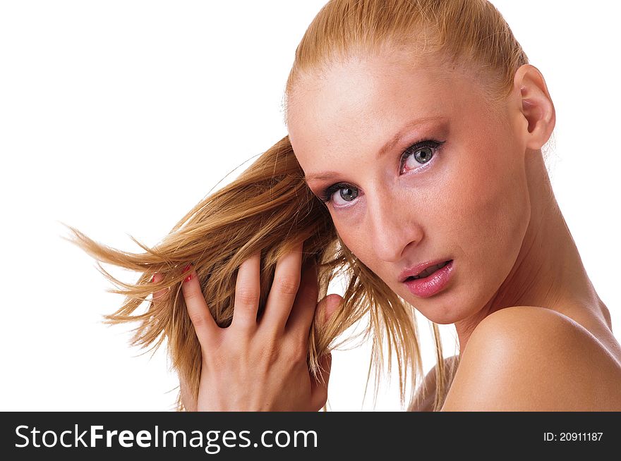 Portrait of pretty young woman playing with her hair. Portrait of pretty young woman playing with her hair