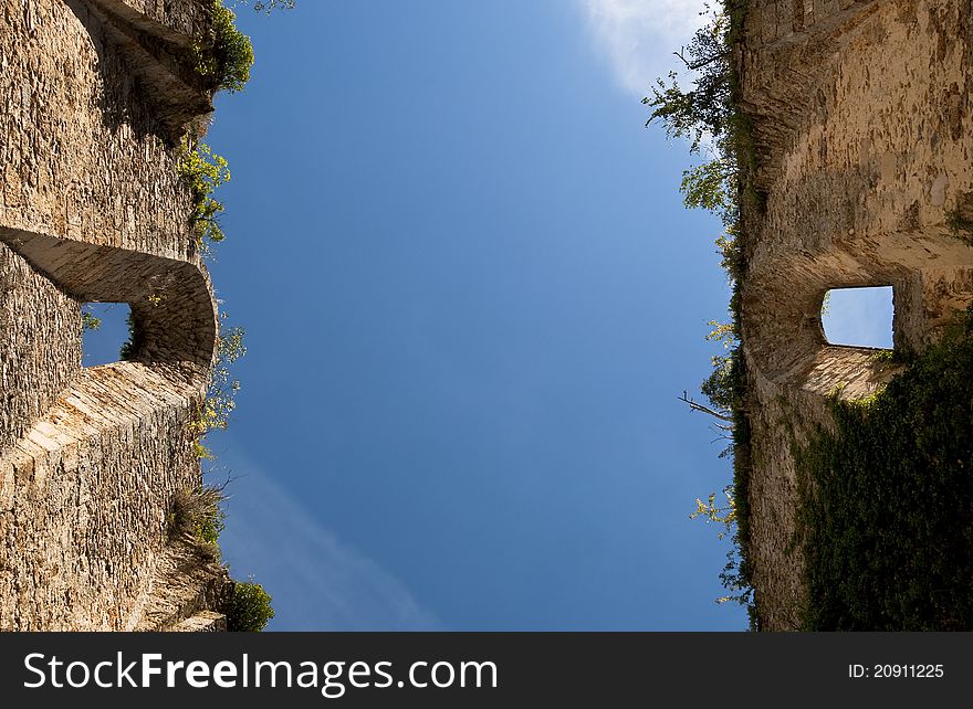 View of the blue sky from a ruined church