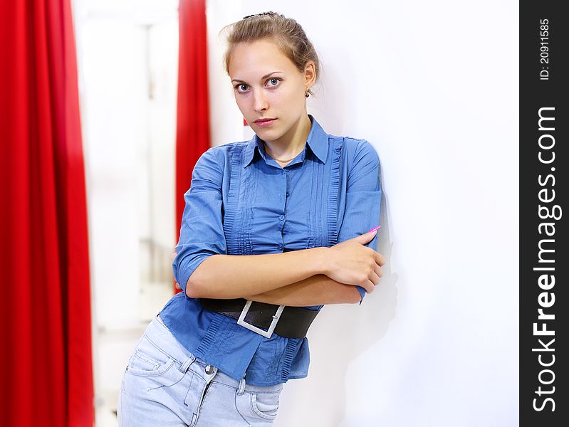 Woman In A Shop Buying Clothes