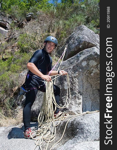 Men prepering to rappeling on waterfall. Men prepering to rappeling on waterfall