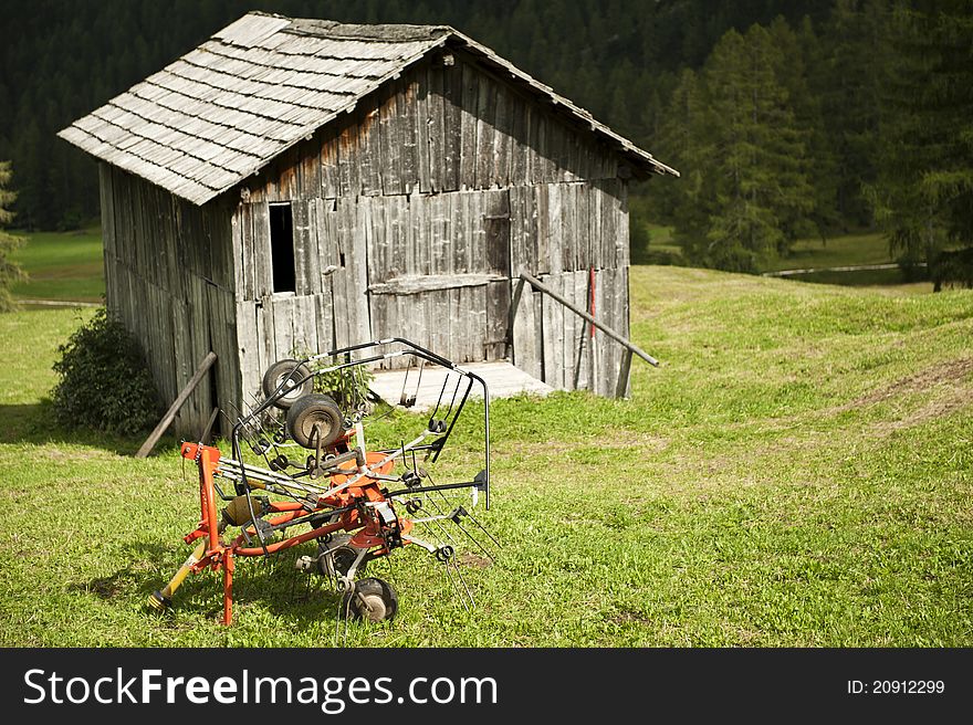 Agricultural implement to gather hay and small barn. Agricultural implement to gather hay and small barn
