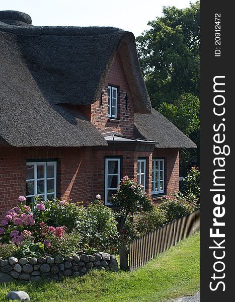 Historic building with thatched roof on the island of Amrum, Germany