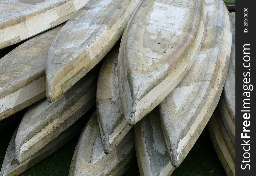 Rows of old vintage kayaks. Rows of old vintage kayaks.